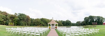 Photo of White Folding Chairs on Grass