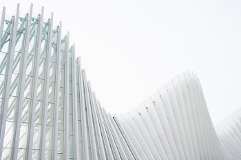 photo of white painted building at daytime