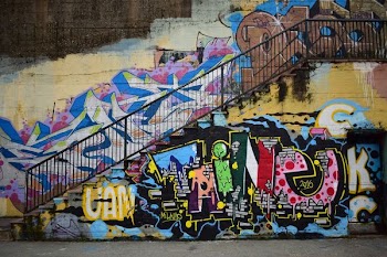 photo of white, pink, and blue graffiti
