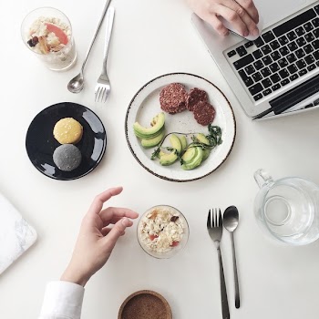 Photo of White Plate Beside Macbook