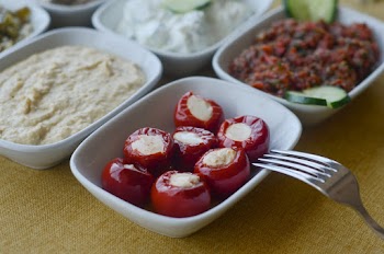 Photo of White Plates With Assorted Food and a Steel Fork