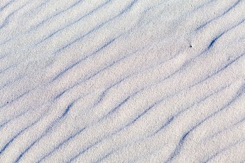 photo of white sand at daytime