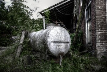 Photo of White Septic Tank Near Brown House