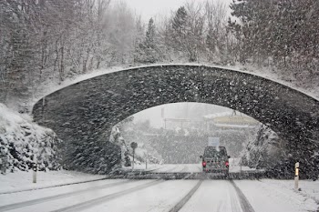 Photo of White Vehicle Crossing a Tunnel 