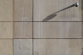 photo of white wall-mounted light