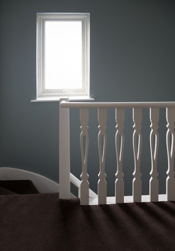 Photo of White Window Frame An White Wooden Stair Balustrade