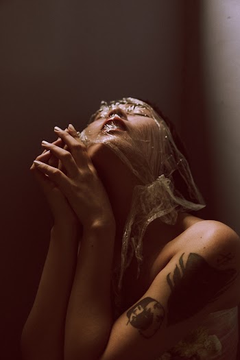 Photo of Woman's Face Covered With Plastic