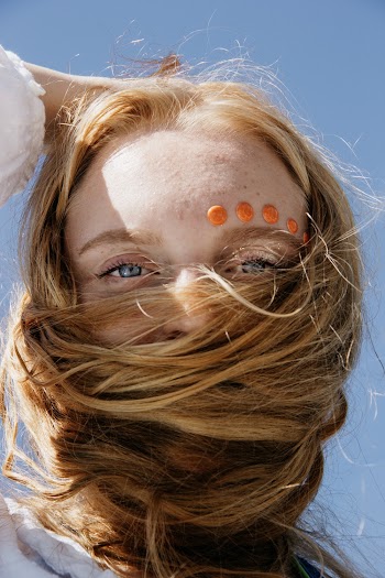 Photo of Woman's Face Wrapped in Her Own Hair