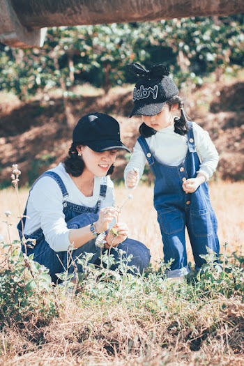 Photo of Woman and Girl on Grass Field