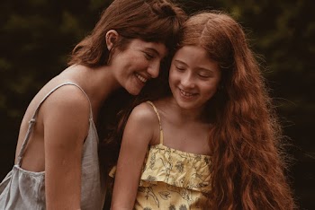 Photo of Woman and Girl Smiling