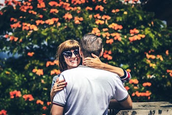 Photo of Woman and Man Hugging Each Other