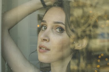 Photo of Woman behind Glass