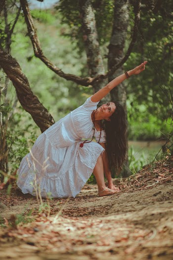 Photo of Woman Bending Beside Tree