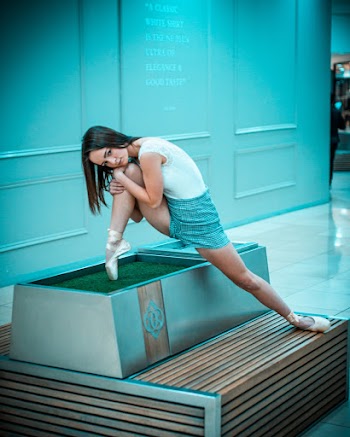Photo of Woman Bending on Platform
