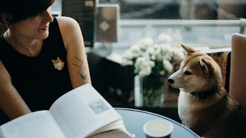 Photo Of Woman Beside Dog