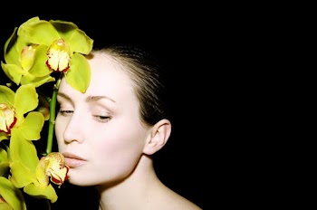 Photo Of Woman Beside Flowers