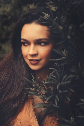 Photo Of Woman Beside Plant
