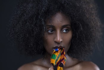 Photo Of Woman Biting Scarf