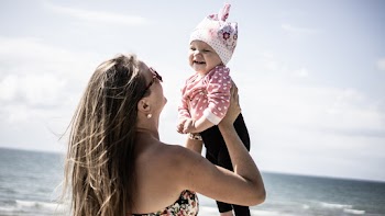 Photo of Woman Carrying A Baby