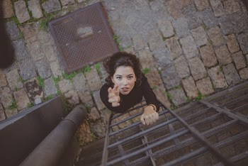 Photo of Woman Climbing on Ladder
