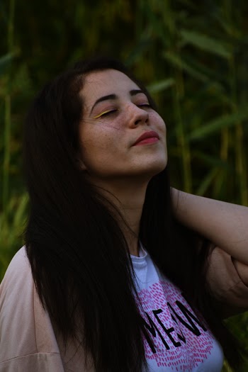 Photo of Woman Closing Her Eyes