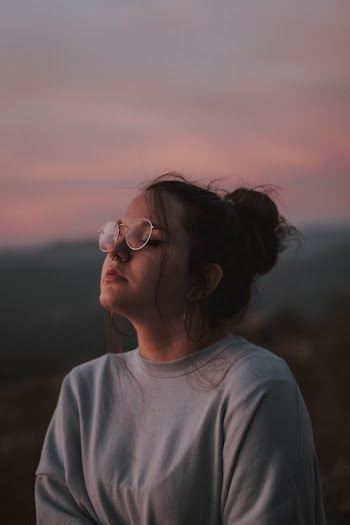 Photo of Woman Closing Her Eyes