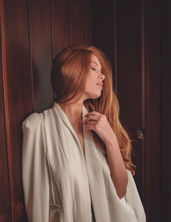 Photo of Woman Closing Her Eyes