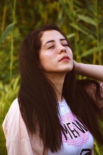 Photo of Woman Closing Her Eyes