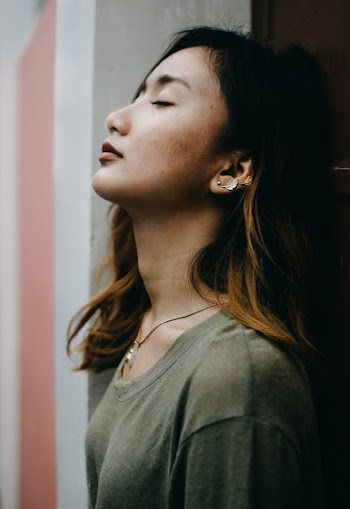 Photo of Woman Closing Her Eyes