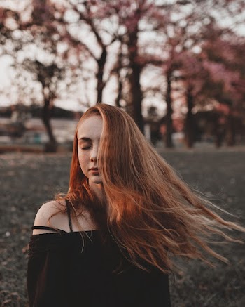 Photo of Woman Closing Her Eyes