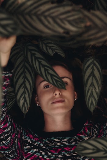 Photo of Woman Covered by Leaves