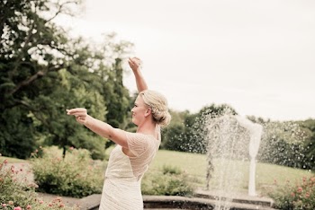 Photo of Woman Dancing Near Water Fountain