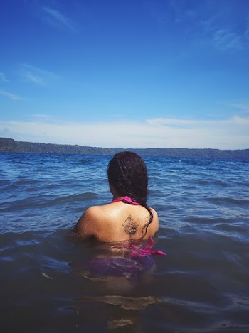 Photo of Woman Dipping in Sea