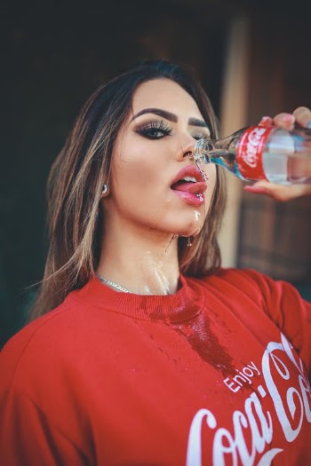 Photo of Woman Holding a Bottle · Free Stock Photo