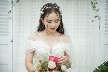 Photo Of Woman Holding A Bouquet Of Flowers