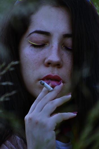 Photo Of Woman Holding A Cigarette