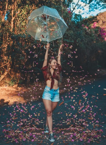 Photo of Woman Holding an Umbrella