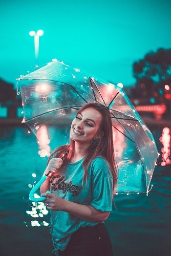 Photo Of Woman Holding An Umbrella 