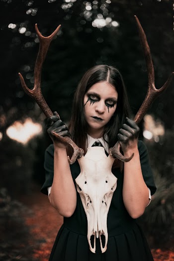 Photo Of Woman Holding Antler