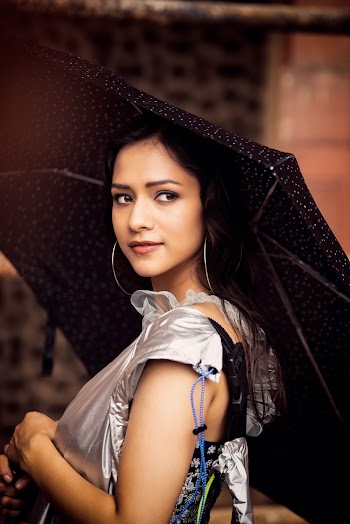Photo of Woman Holding Black Umbrella