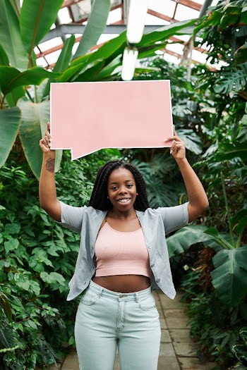 Photo of Woman Holding Blank Signboard