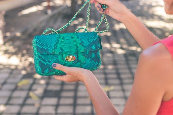 Photo of Woman Holding Blue Crossbody Bag