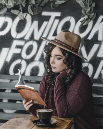 Photo Of Woman Holding Book