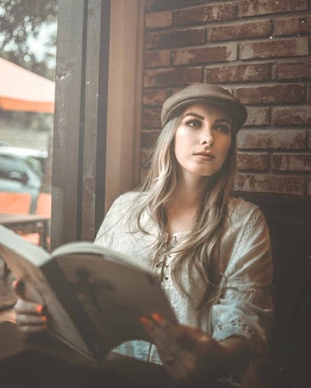 Photo Of Woman Holding Book
