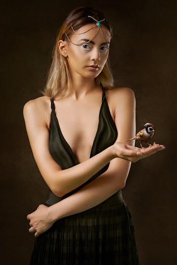 Photo of Woman Holding Brown Bird