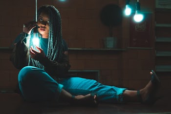 Photo Of Woman Holding Bulb