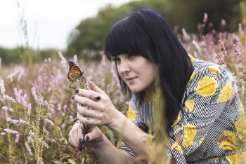Photo of Woman Holding Butterfly