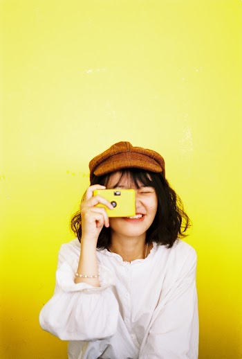 :Photo of Woman Holding Camera