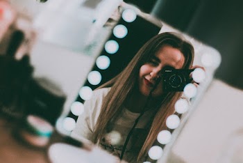 Photo Of Woman Holding Camera