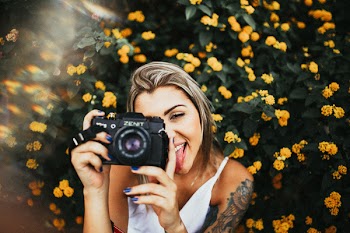 Photo of Woman Holding Camera